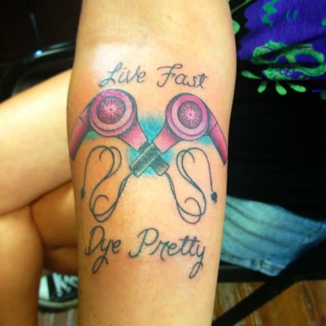 Two Blow Dryers With Live Fast And Dye Pretty Tattoo On Forearm