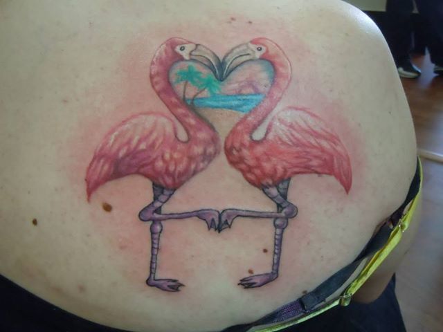 Two Flamingos Making Heart Shape With Trees And Sea Tattoo