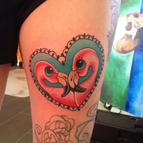 Two Red Flamingos In Heart Shape Frame Tattoo On Thigh
