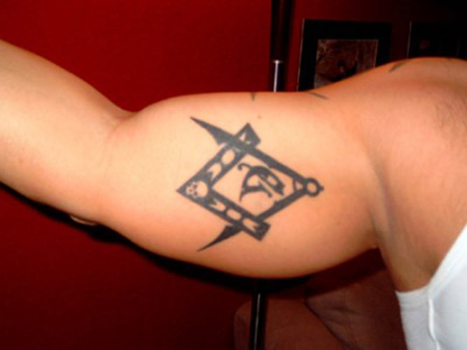 Black Ink Masonic Tattoo On Inner Bicep