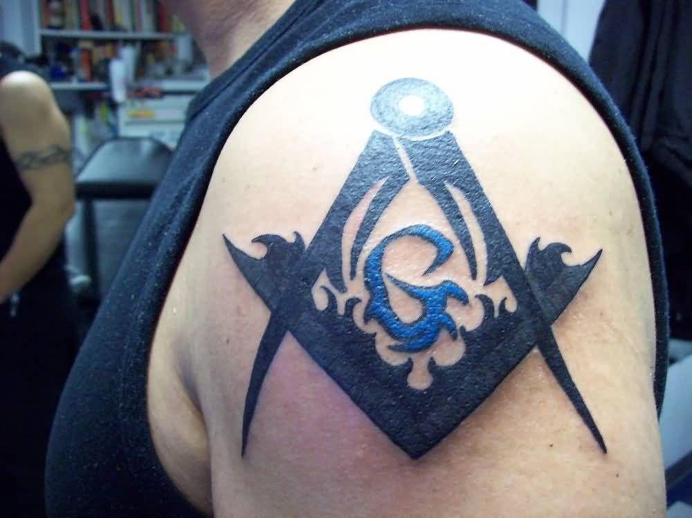 Black Tribal Masonic Tattoo On Man Left Shoulder