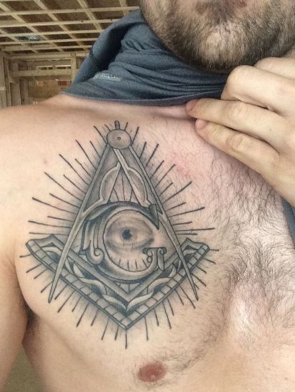 Grey Ink Masonic Tattoo On Man Chest