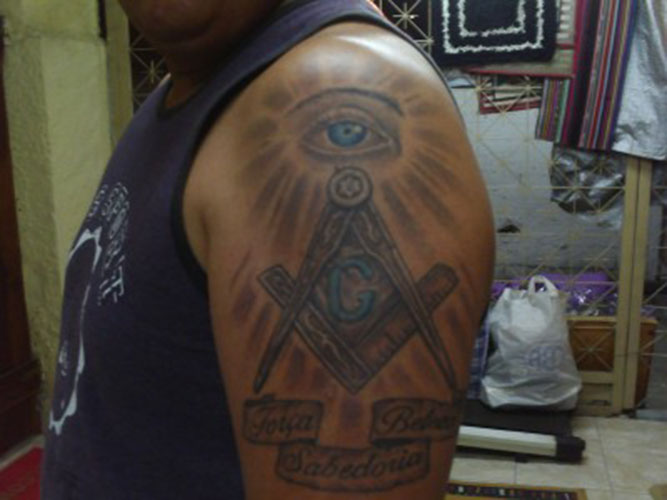 Grey Ink Masonic Tattoo On Man Left Shoulder