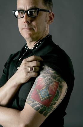 Man Showing His Masonic Tattoo On Left Half Sleeve