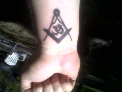 Om Symbol In Masonic Tattoo On Right Wrist