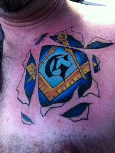 Ripped Skin Masonic Tattoo On Front Shoulder