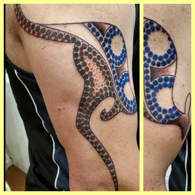Aboriginal Tattoo On Man Shoulder