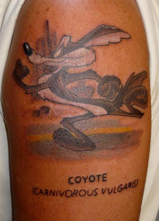Animated Cartoon Coyote Tattoo On Left Shoulder