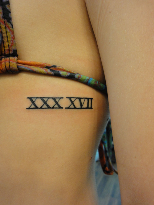 Beautiful Roman Numerals Tattoo On Side Rib