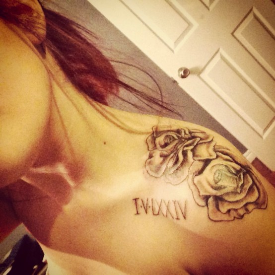 Beautiful Roman Numerals With Flowers Tattoo On Left Upper Shoulder