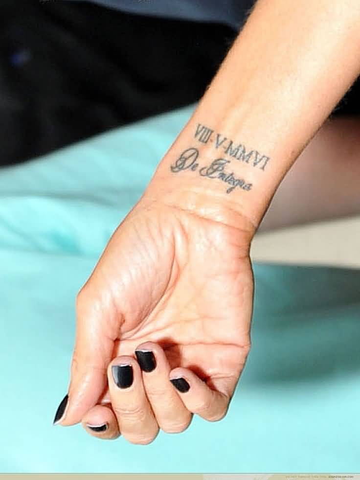 Beautiful Roman Numerals With Lettering Tattoo On Wrist