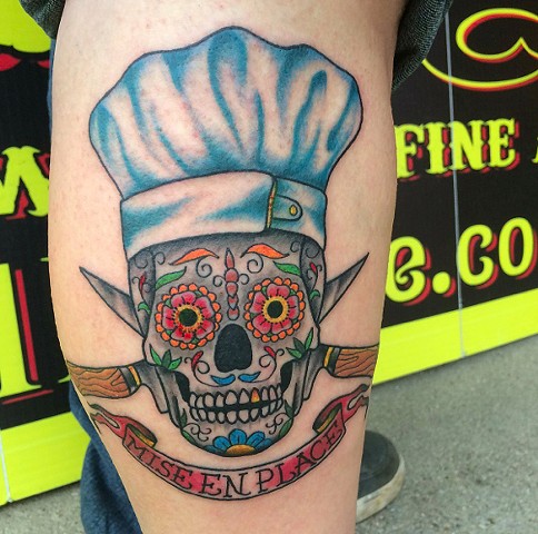 Beautiful Sugar Skull With Crossed Knives And Miseen Place On Banner Tattoo On Half Sleeve