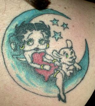 Betty Boop Lying On Moon With Puppy Tattoo