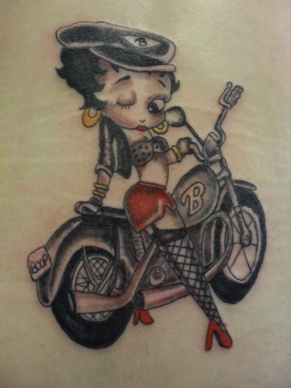 Betty Boop Riding Bike Tattoo Idea