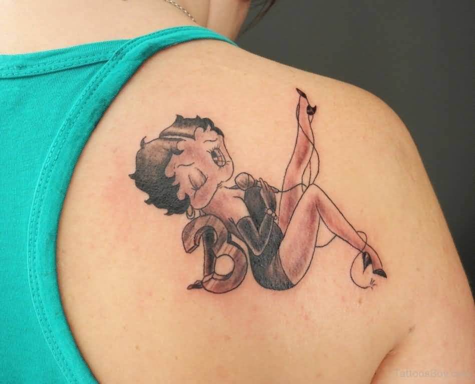 Betty Boop Sitting With Letter B Tattoo On Right Back Shoulder