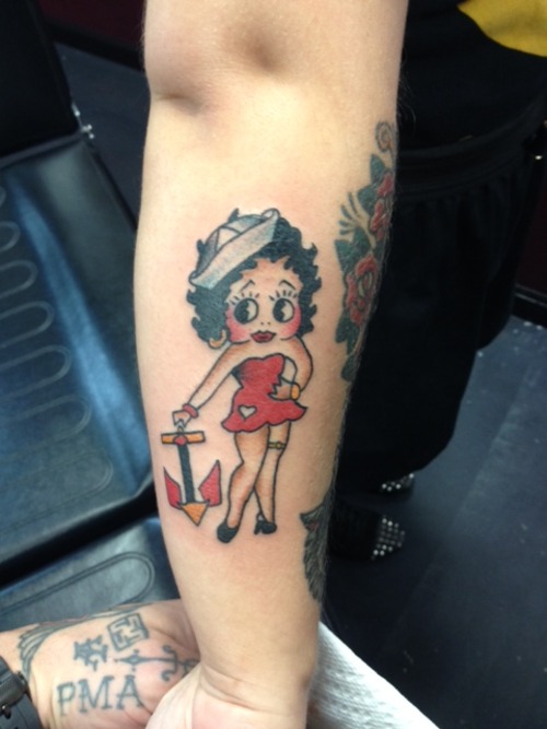 Betty Boop With Colored Anchor Tattoo On Arm