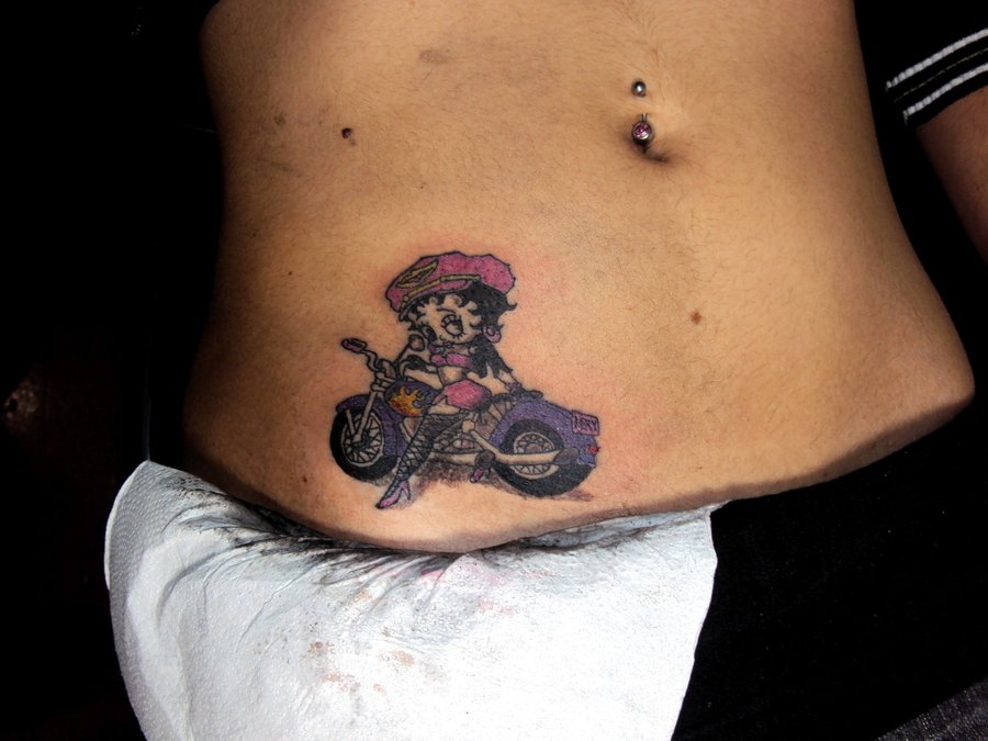 Biker Betty Boop Tattoo On Right Hip by BixoTattoo
