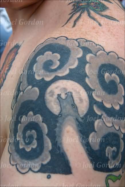 Black And Grey Clouds With Coyote Tattoo On Shoulder