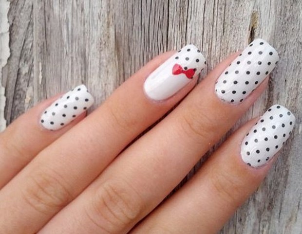 Black And White Polka Dots Nail Art With Accent Red Bow Design