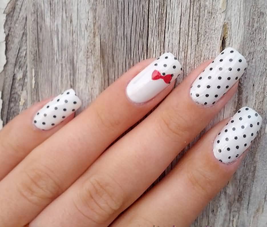Black And White Polka Dots Nail Art With Accent Red Bow