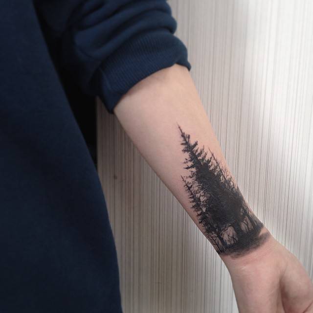 Black Forest Tree Tattoo On Left Wrist