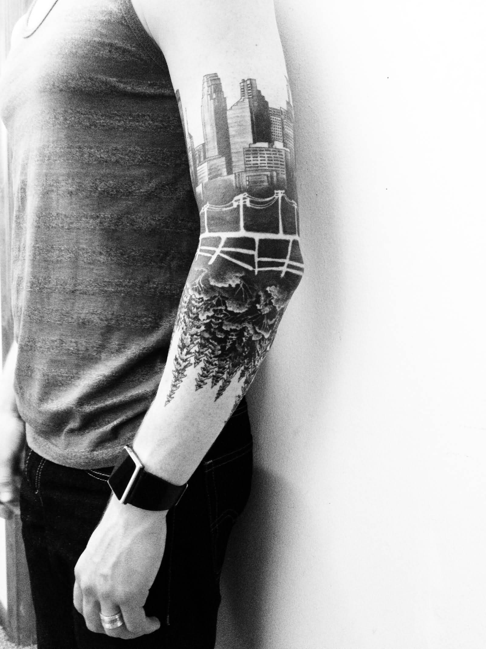 Black Ink Forest Tattoo On Man Left Sleeve