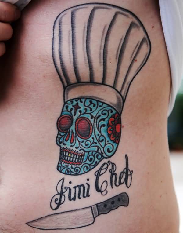 Blue Color Chef Skull With Knife And Text Tattoo On Side Rib