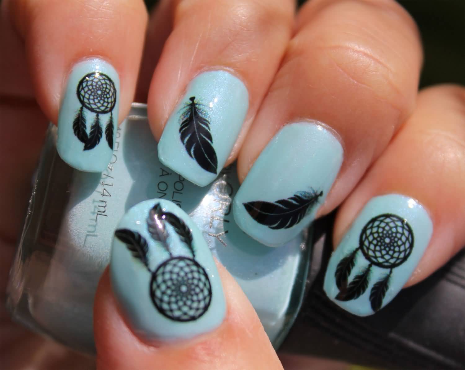 Blue Nails With Black Feather And Dreamcatcher Nail Art