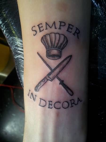 Chef Hat With Knife And Lettering Tattoo On Forearm