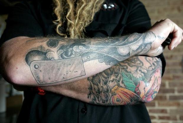Chef Knife With Fish And Other Stuff Tattoo On Both Forearms