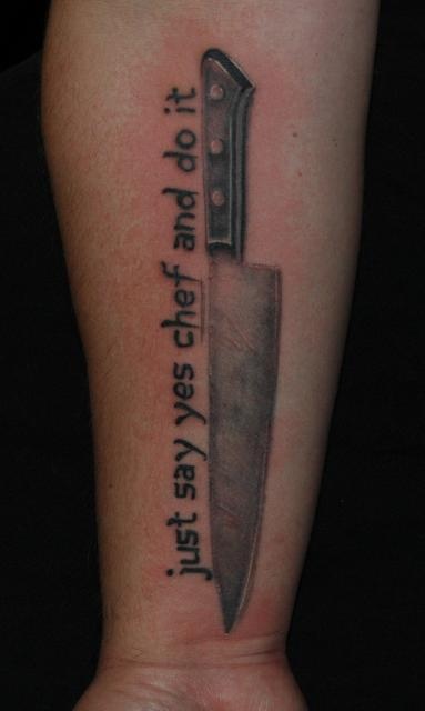 Chef Large Knife With Lettering Tattoo On Forearm
