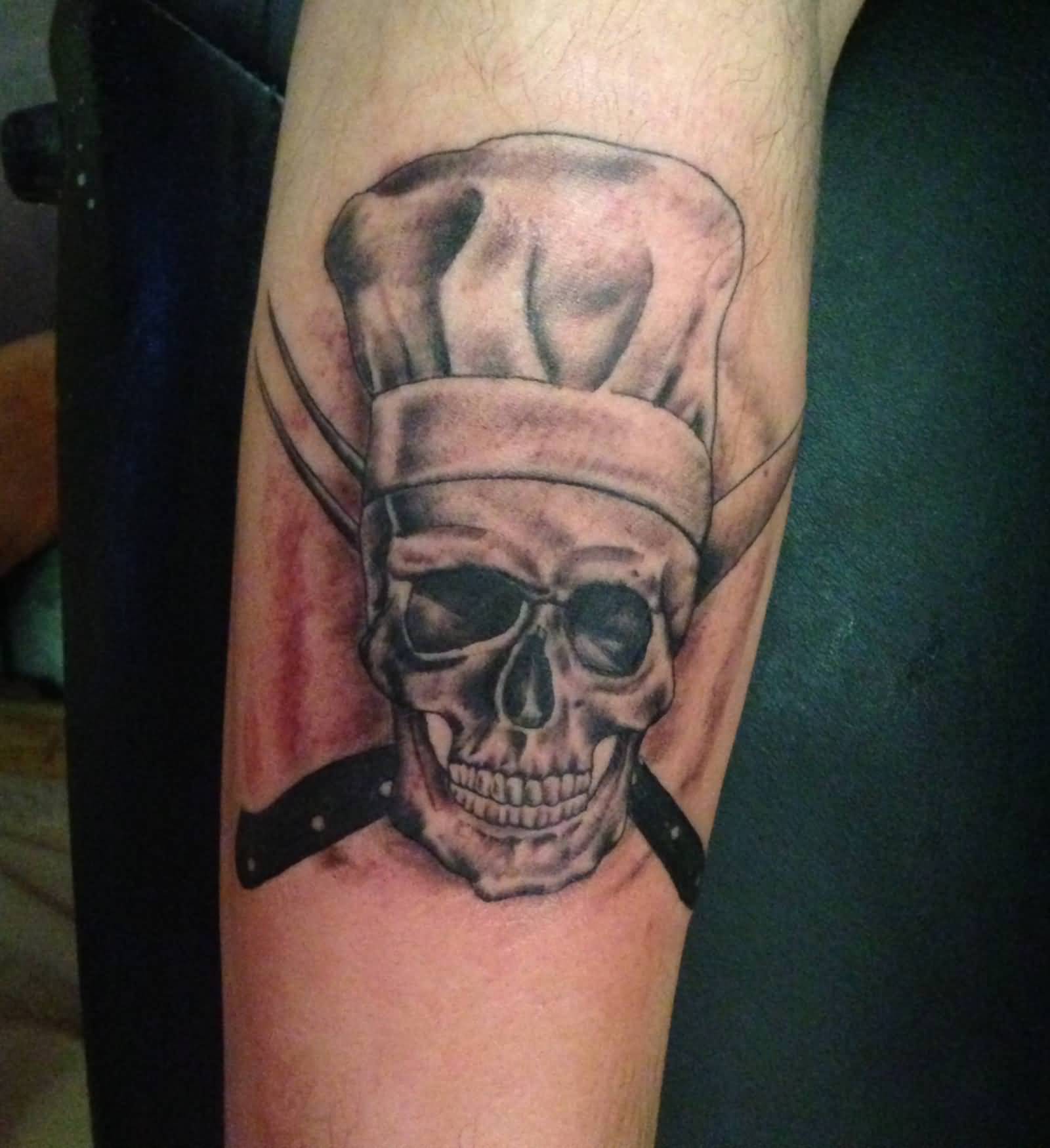 Chef Skull Wearing Cap With Cross Knife Tattoo On Forearm