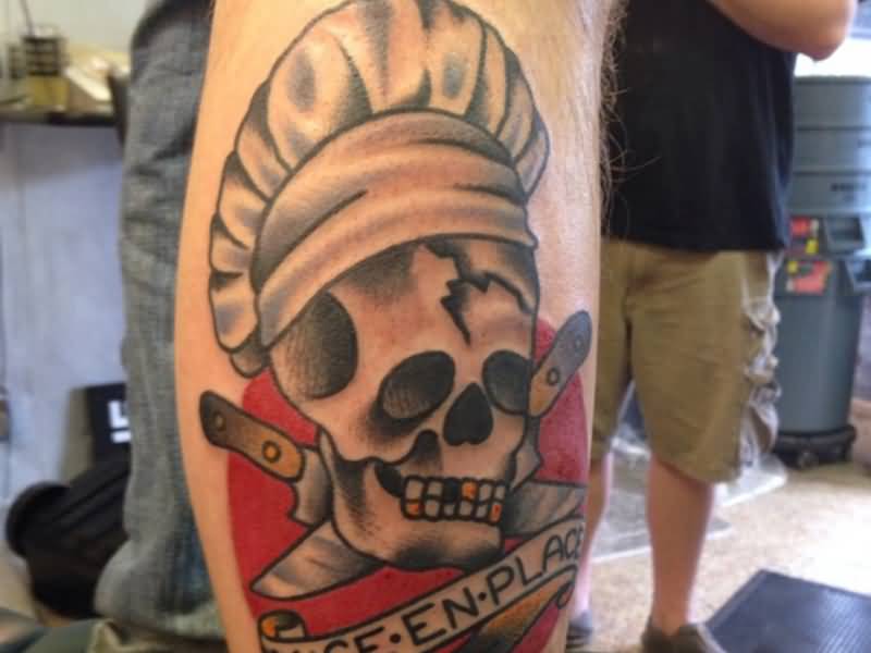 Chef Skull With Crossed Knives And Lettering On Banner Tattoo