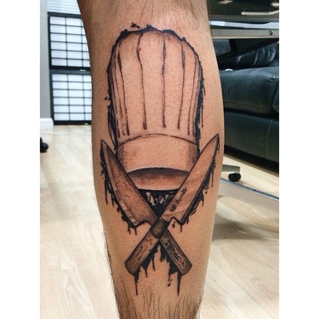 Chef With Cross Knives Tattoo On Forearm