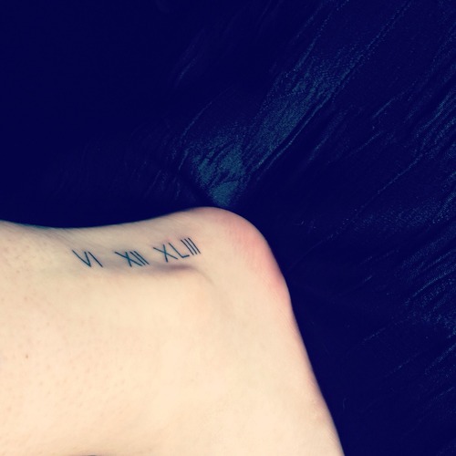 Classic Roman Numeral Tattoo On Ankle