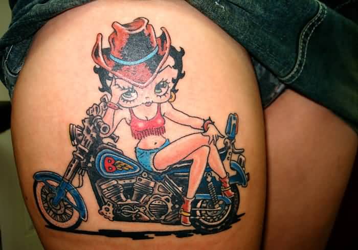 Colored Betty Boop With Bike Tattoo On Thigh