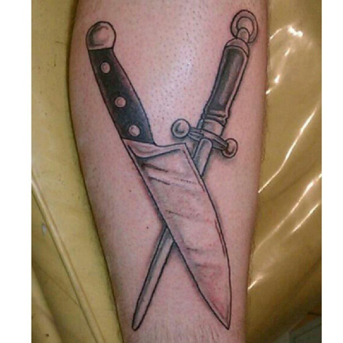 Crossed Knives Tattoo On Forearm