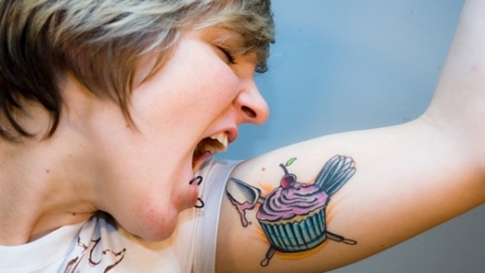 Cute Cup Cake With Crossed Spoon And Egg Beater Tattoo On Bicep