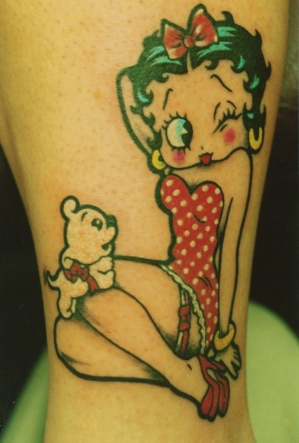Cute Small Puppy And Betty Boop Tattoo On Left Sleeve