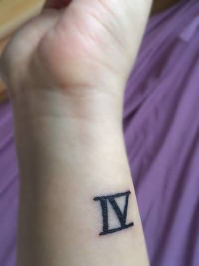Dark Black Color Roman Numeral Four Tattoo On Wrist