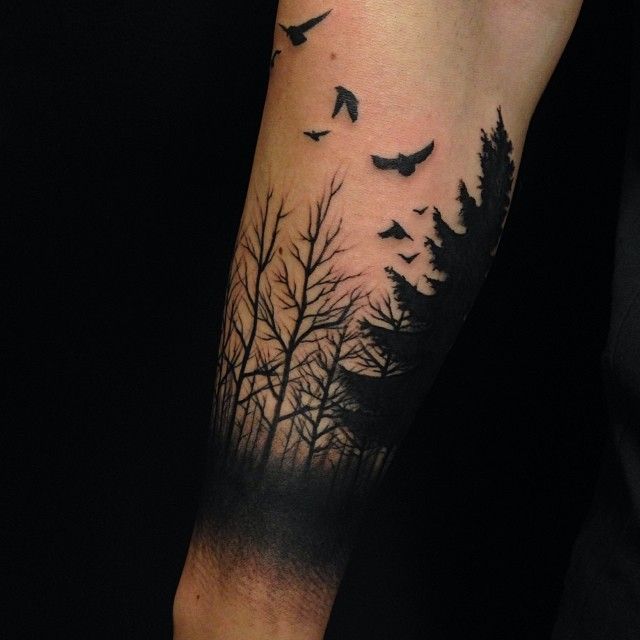 Dark Black Ink Forest Tattoo On Arm