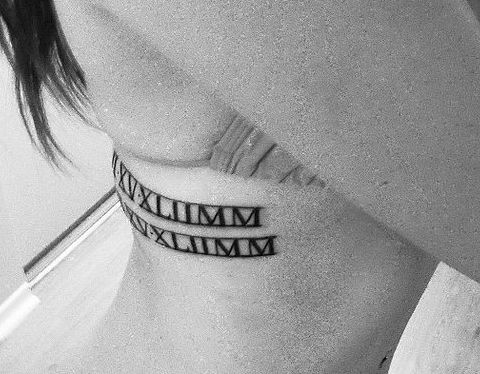 Extremely Beautiful Roman Numerals Tattoo On Side Rib For Girls