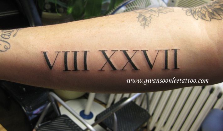 Extremely Nice Roman Numerals Tattoo On Forearm