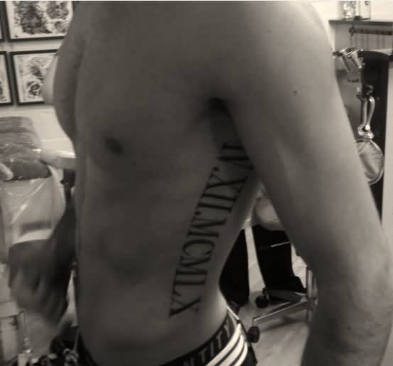 Extremely Nice Roman Numerals Tattoo On Side Rib