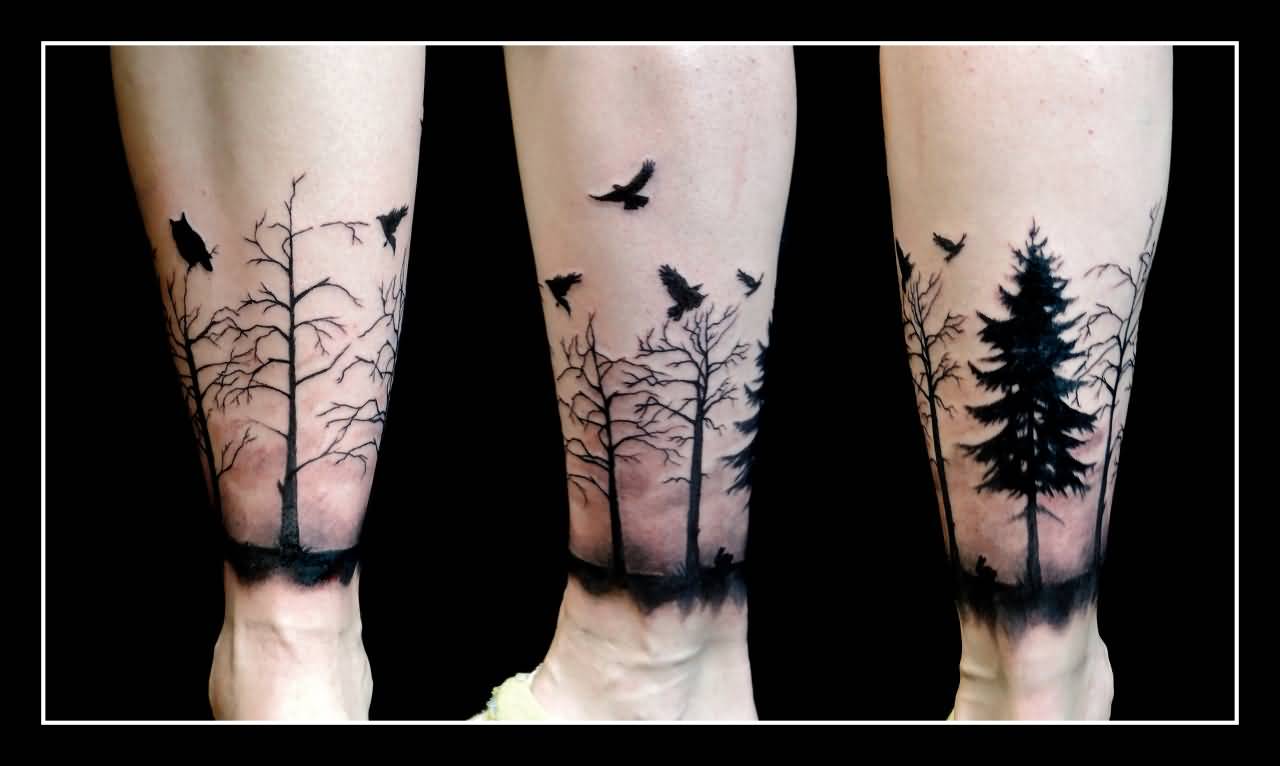 Flying Black Birds And Tree Forest Tattoo On Leg
