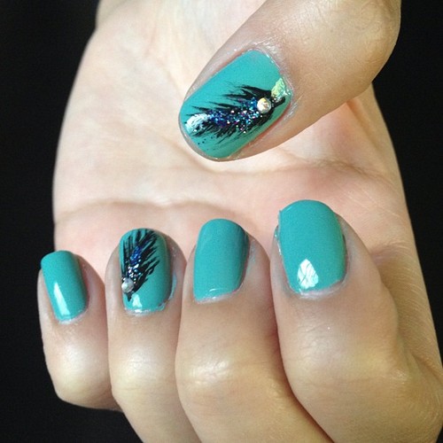 Green Nails With Glitter Feather Nail Art