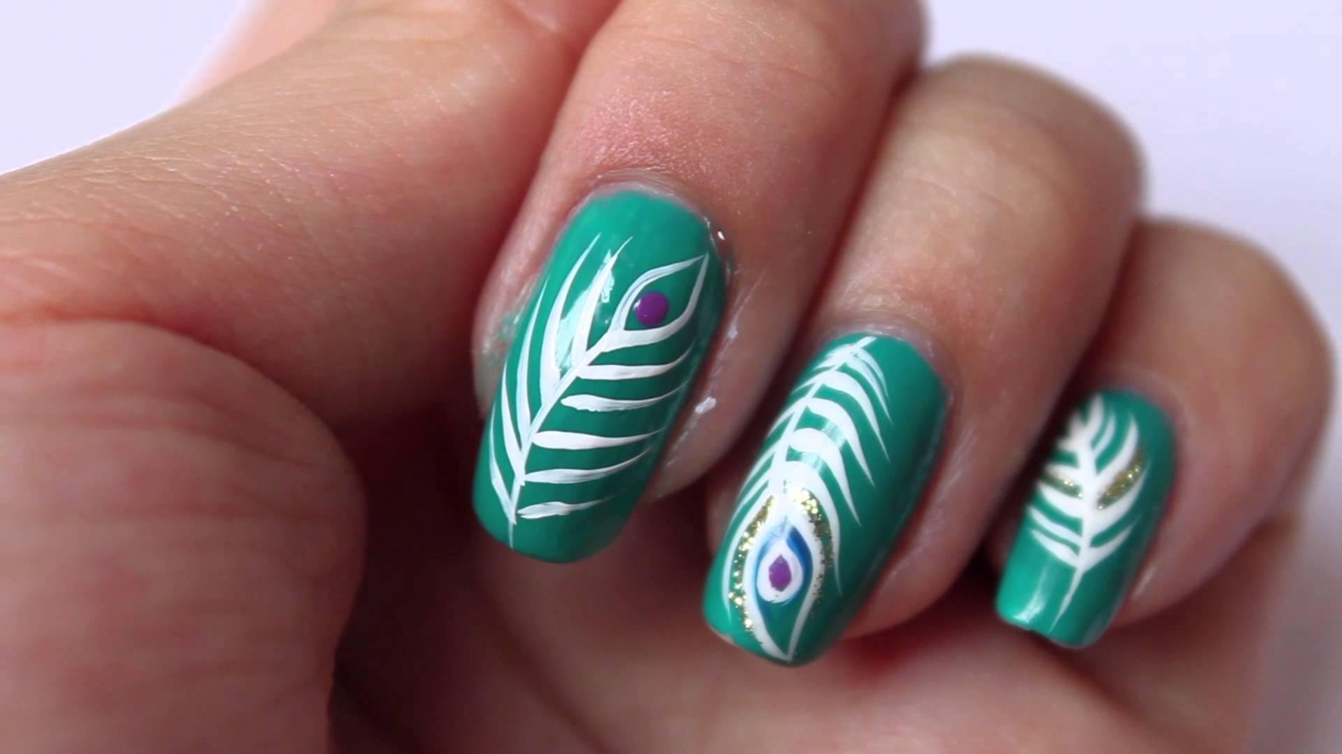Green Nails With White Peacock Feather Nail Art