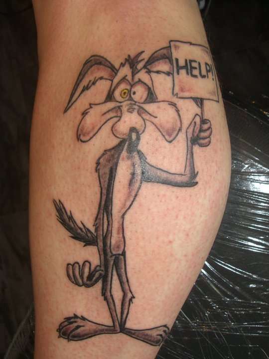 Grey Ink Coyote With Help Banner Tattoo On Leg