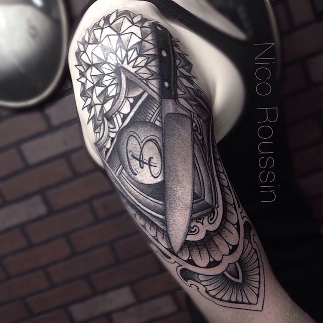 Incredible Chef Knife And Shield On Shoulder Tattoo