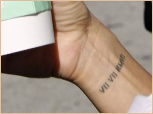 Light Inked Roman Numerals Tattoo On Wrist